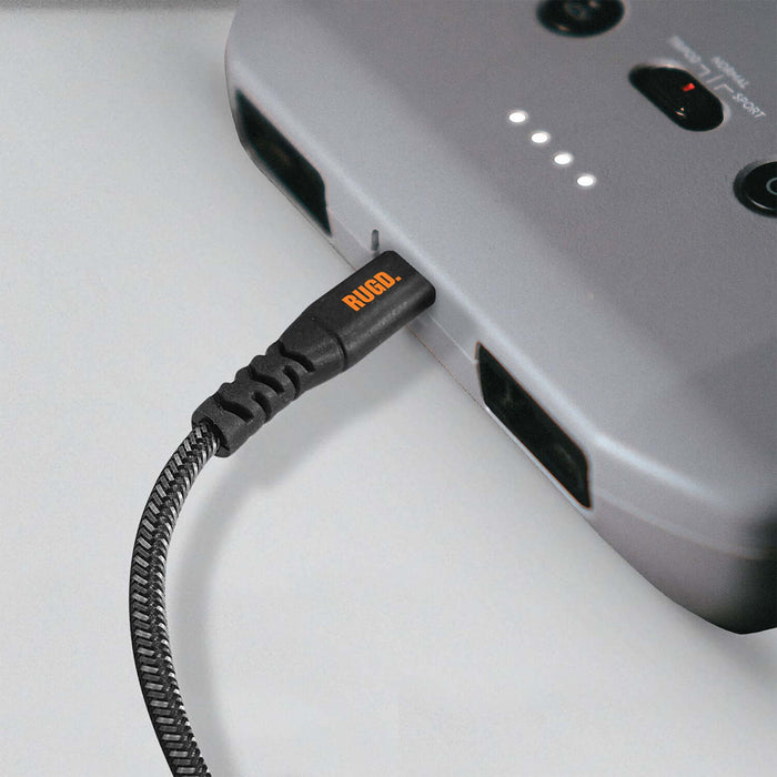 RUGD. Rhino Power USB-C to USB-C charging cable connected to a device, showcasing its strength and durability.