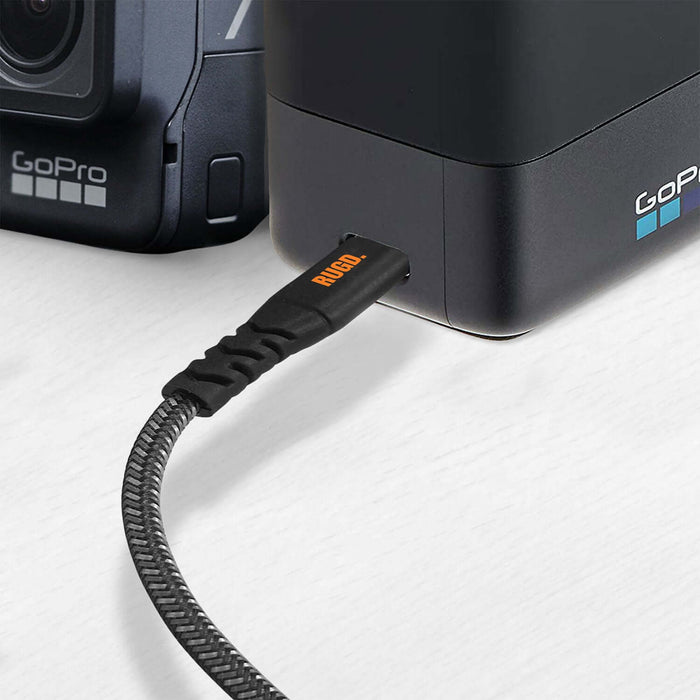 RUGD. Rhino Power USB-C to USB-C charging cable connected to GoPro device, showcasing durability and strength.