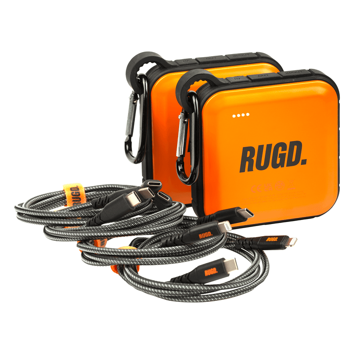 RUGD. Double Pack Bundle with two orange power banks and charging cables for outdoor adventures.