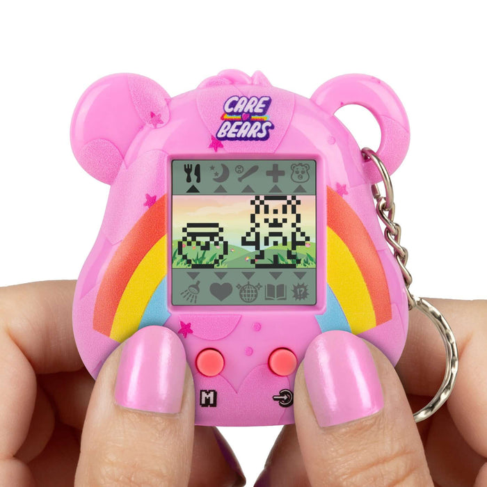 Care Bears Digital Pet handheld device with pixel animations and rainbow design, featuring character gameplay.