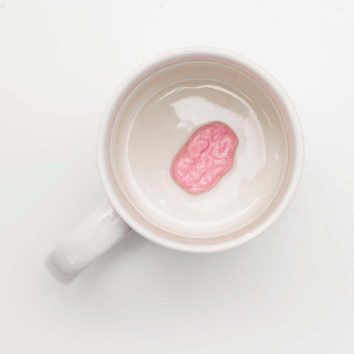 Chewing Gum 'Prank' Mug featuring a hidden pink gumball at the bottom, perfect for surprise sips.