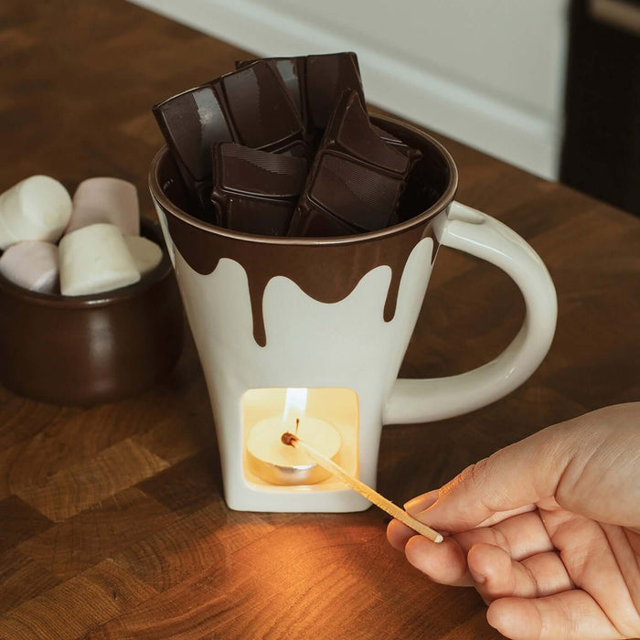Chocolate Fondue Mug with melted chocolate, dipping forks, and candle for cozy evenings and treats.