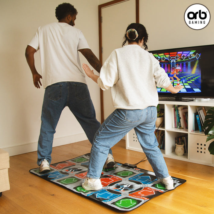 Two players enjoying the Orb - Retro Arcade Dance Mat (2 Player) while dancing in a living room.