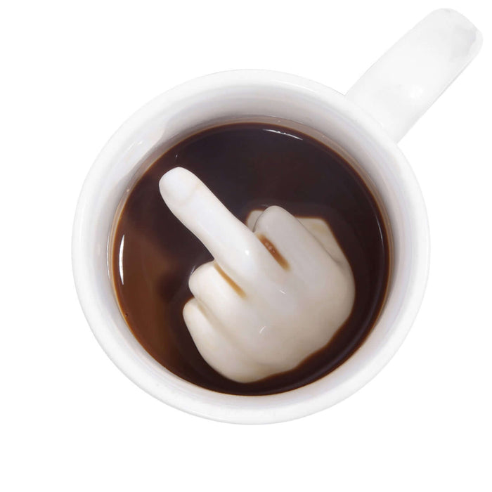 Top view of Up Yours 'Prank' Mug with coffee showing a hidden hand gesture inside.