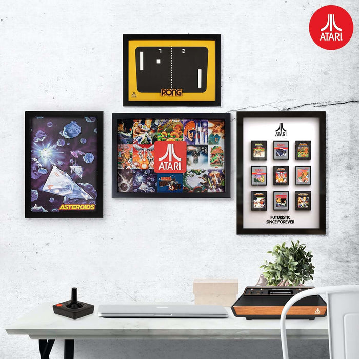 Official Atari 3D Wall Art featuring classic game designs like Pong, Legends and Asteroids in a modern gaming setup.