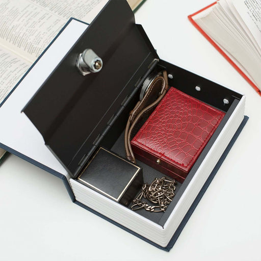 "Open Book Safe resembling a dictionary revealing hidden valuables inside, featuring a lock and key mechanism for enhanced security."