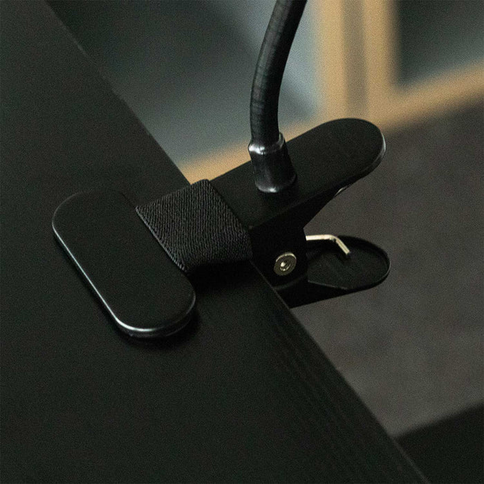 Lazy Arm Smartphone Holder with strong Claw Grip securely attached to a table.