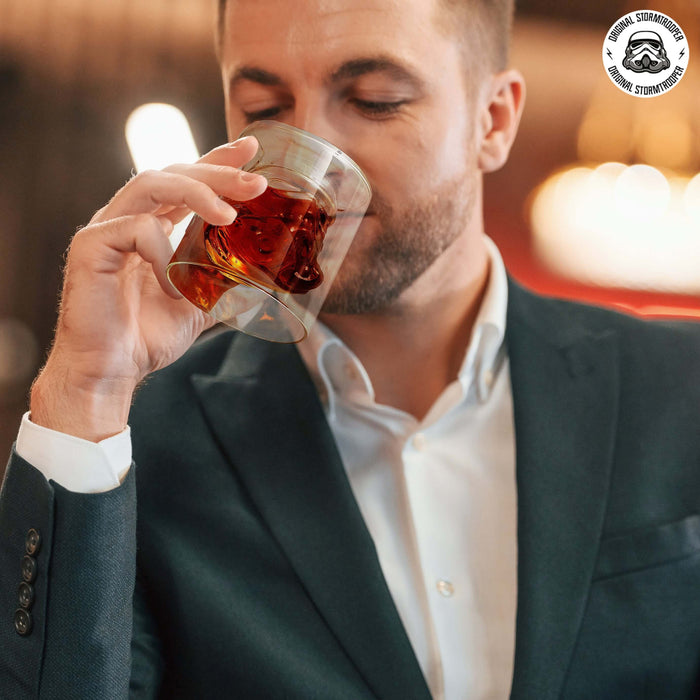 Man sipping whiskey from a Stormtrooper 3D Inverted Whiskey Glass in a casual setting