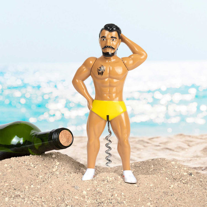 Mr. Lovin' Cork Screw on a beach with a wine bottle, showcasing its stylish and quirky design, perfect for wine lovers.