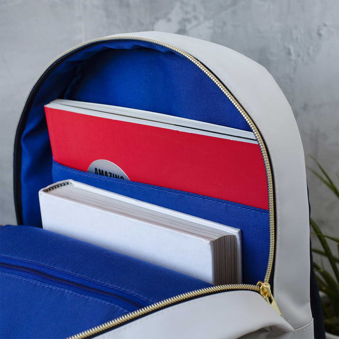 Interior view of NASA Backpack showing organized storage with notebooks and compartments.