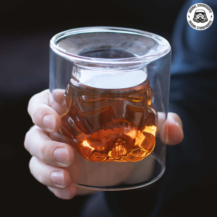 Person holding Stormtrooper 3D Inverted Whiskey Glass filled with whiskey.
