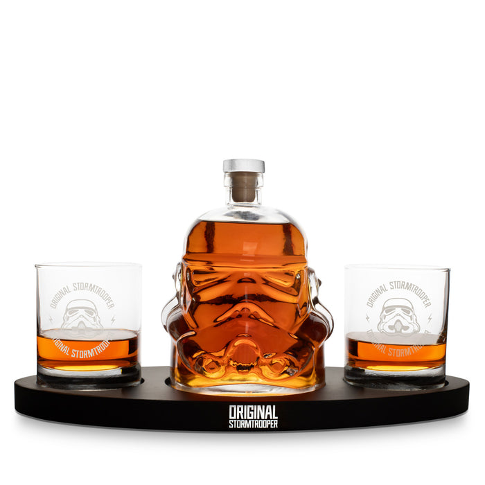 Original Stormtrooper whiskey decanter and tumbler glass set by ThumbsUp, sci-fi themed barware with helmet design and display base.
