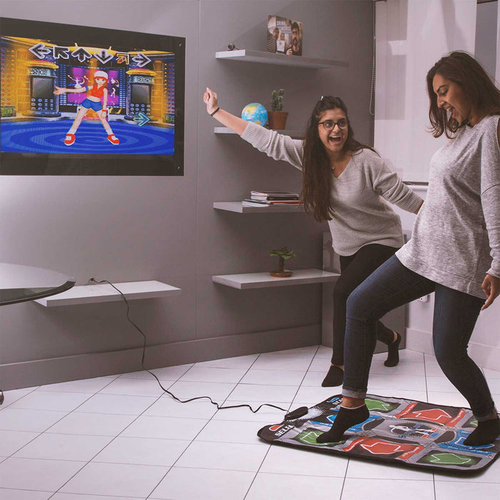 Two people enjoying a dance game on the Orb Retro Arcade Dance Mat in a living room.
