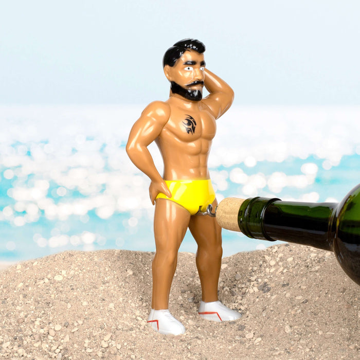 Thumbs Up novelty toy lifeguard figure displayed on sand with seaside backdrop