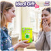 Two women joyfully exchanging the Care Bears Digital Pet, an ideal gift. Bright room setting with cheerful expressions.