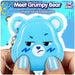 Meet Grumpy Bear, the blue digital pet with unique facial expressions and a playful design.