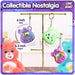 Care Bears collectible digital pets display, featuring Share Bear and another character on a stand.