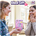 Two friends happily sharing the Care Bears Digital Pet gift featuring Share Bear in a bright, welcoming room.