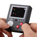 Atari handheld console with a colorful LCD screen and gameplay controls in use, showcasing classic gaming nostalgia.