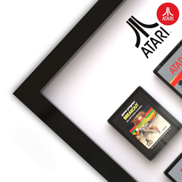 Close-up of Official Atari 3D Wall Art featuring classic game cartridges, showcasing vibrant retro designs in a sleek frame.