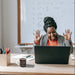 Excited person at desk with Chemistry Mug featuring caffeine formula, in front of laptop and whiteboard, blending science with coffee.