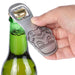 Hand holding an Original Stormtrooper Bottle Opener over a green beer bottle, showcasing its unique design and functionality.