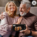 Happy couple holding the Original Stormtrooper 3D Whisky Glass gift set with iconic Stormtrooper helmet design.