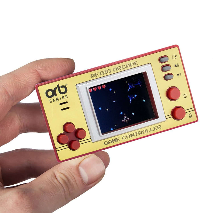 Retro Mini Handheld Games Console with 1.8-inch screen displaying classic 8-bit game, held in hand. Orb Gaming branding visible.