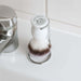 Original Stormtrooper grooming brush displayed on a countertop next to a faucet, featuring an iconic design.