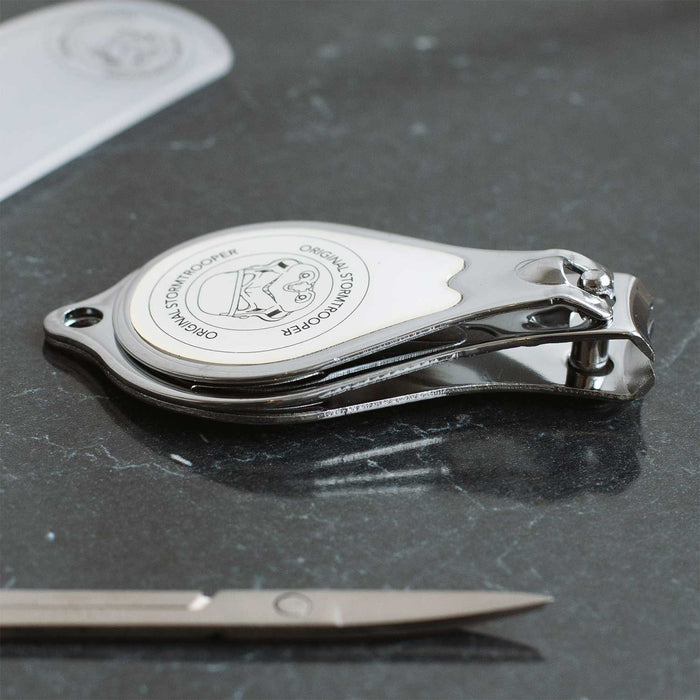 Original Stormtrooper Grooming Set nail clippers featuring iconic design by Andrew Ainsworth on a sleek surface.