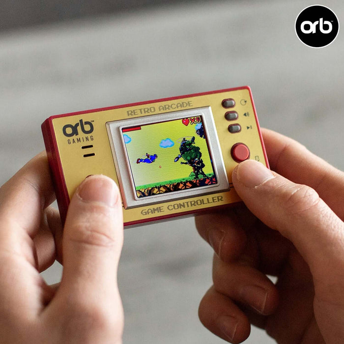 Person playing a retro game on an Orb handheld games console with a 1.8-inch colour screen.