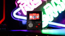 Official Atari handheld console keyring showcasing classic games in a portable, nostalgic design.