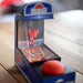 Retro mini arcade basketball game on tabletop with digital score display and orange basketball, providing nostalgic arcade fun.