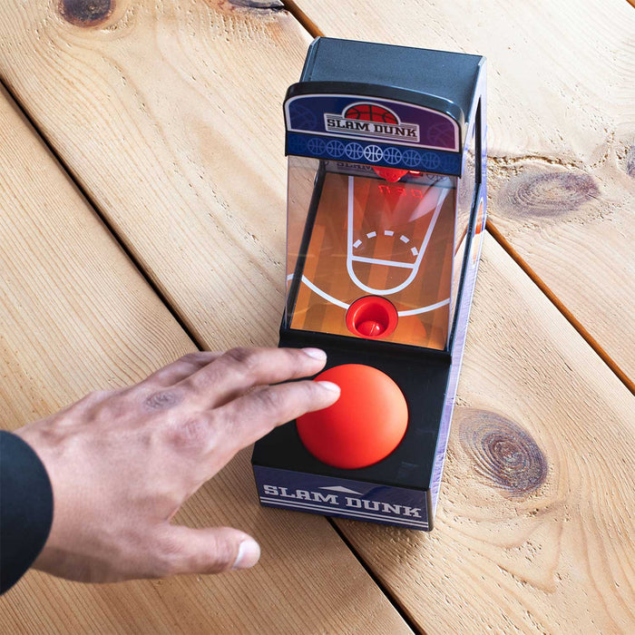 Retro tabletop arcade basketball game being played with a press of a button